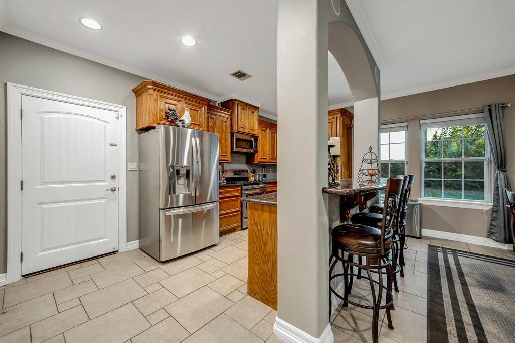 Off the kitchen is the oversized garage