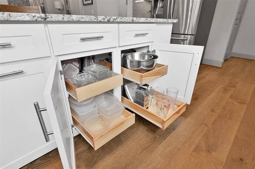 Pull out shelving in lower cabinets offer ease and convenience for access and storage.