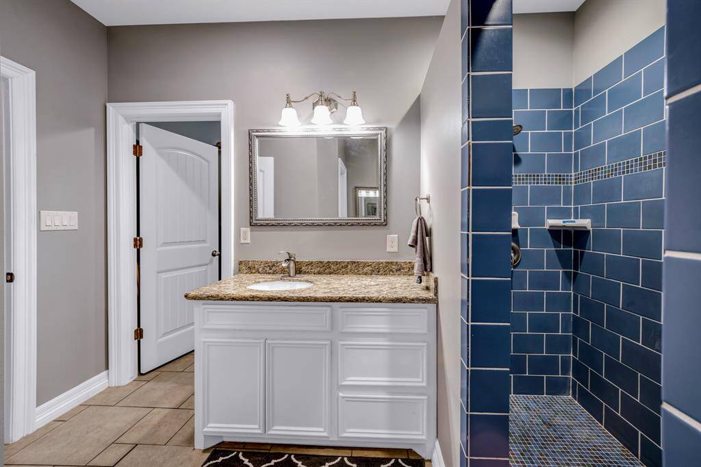The owners bath offers a double shower