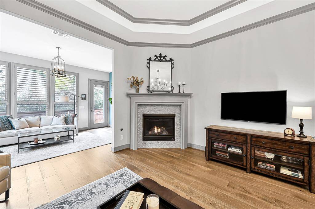 The living area opens to a fantastic sunroom perfect for early morning coffee or evening relaxation.