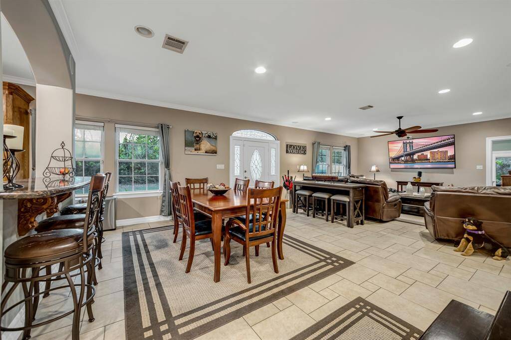 The breakfast bar and dining area are open to the family room-Perfect for indoor entertaining