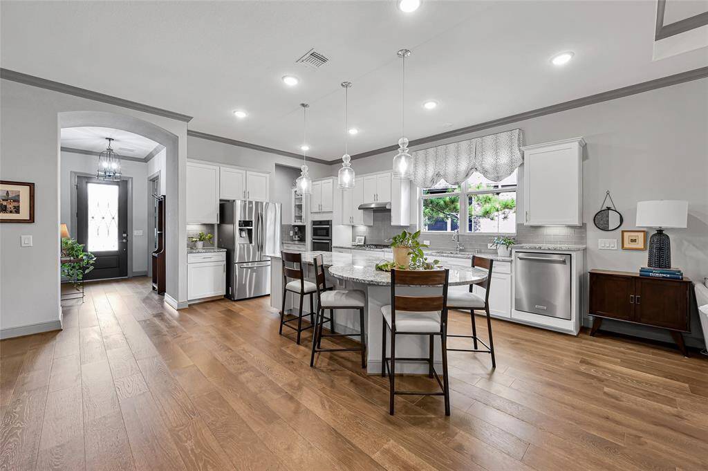 Your home chef will love this kitchen with sleek granite counters and stainless appliances perfect for prepping and cooking a delicious meal.