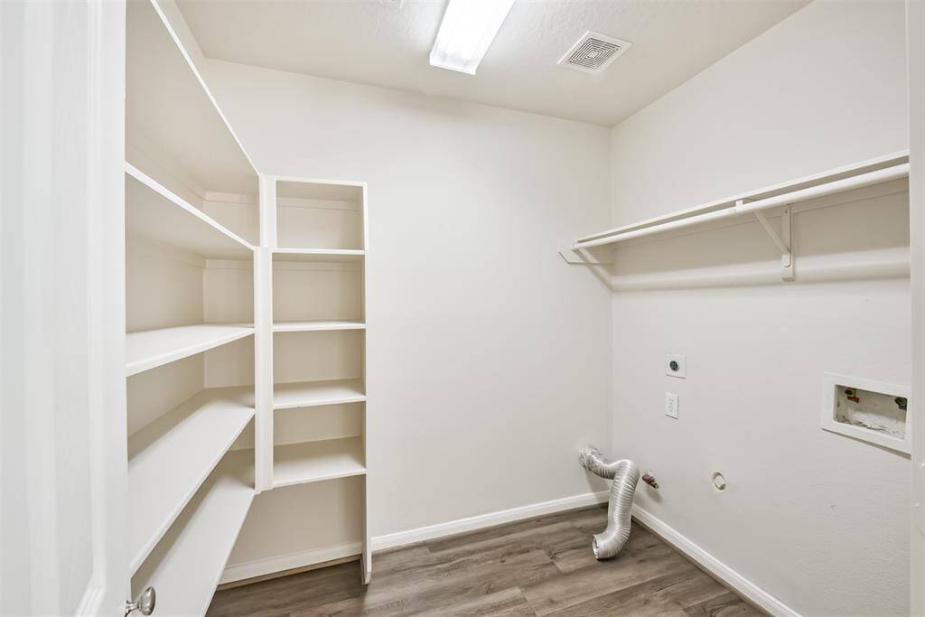 Combo Walk-In Pantry and Utility Room.  Huge area with lots of storage space!