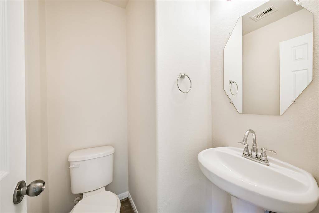 Convenient Half-Bath downstairs for guests.