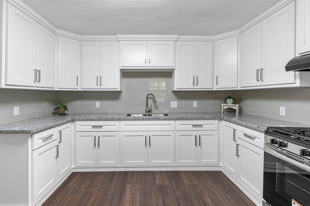 New cabinets, Granite tops, back splash, sink and facet.