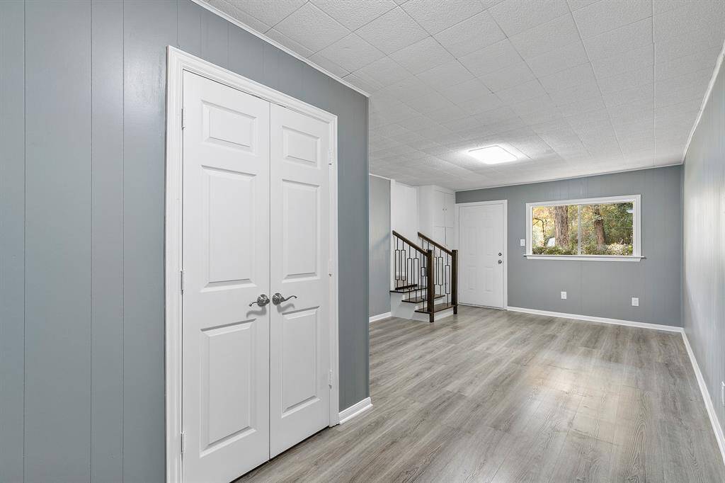 These doors go to the utility, the door to the right goes out front and stairs to the kitchen