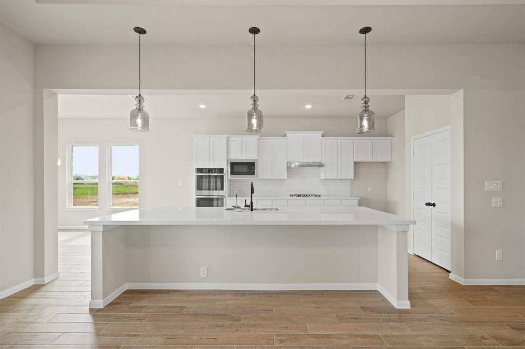 Lovely island kitchen with pendant lighting