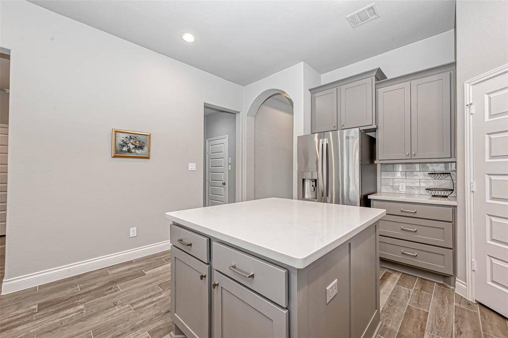 Your large island offers the perfect place for meal prepping! You even have electrical outlets, and added storage! The refrigerator is included in the lease!