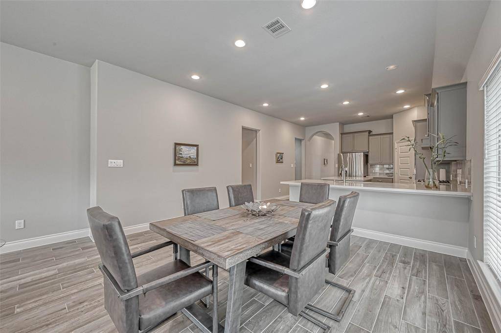 This spacious dining area is perfectfor entertaining and willaccommodate a large table for manydinner guests.