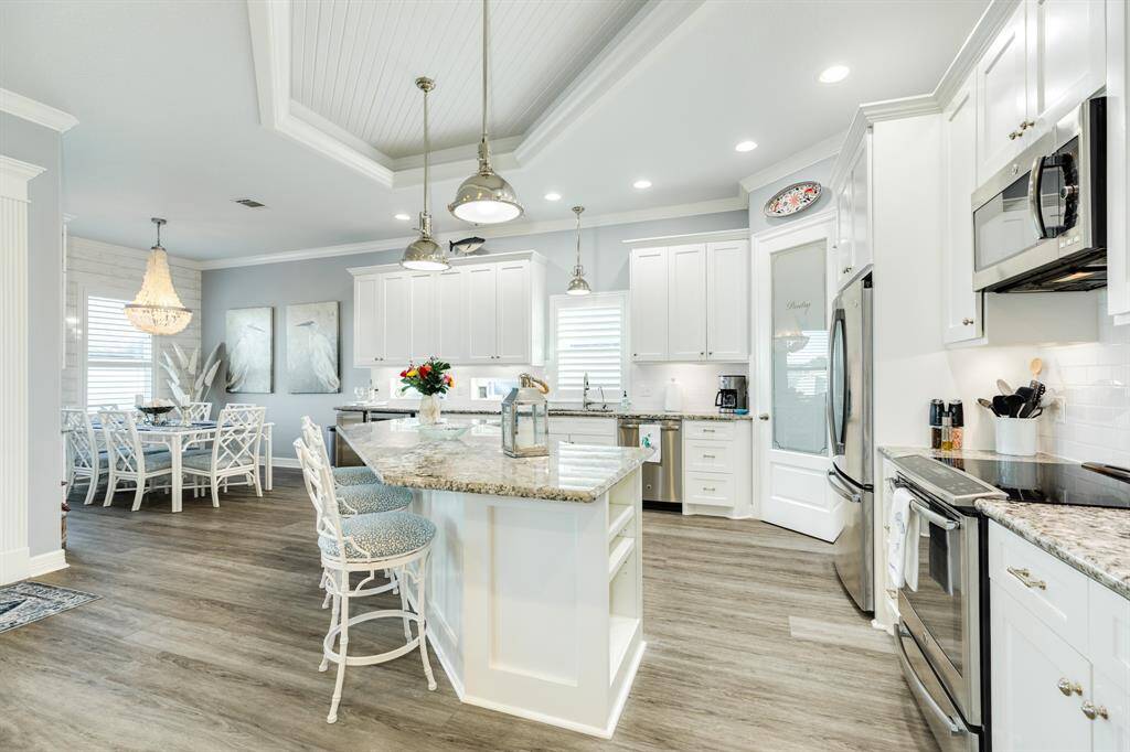 Panoramic view of the kitchen & dining area.