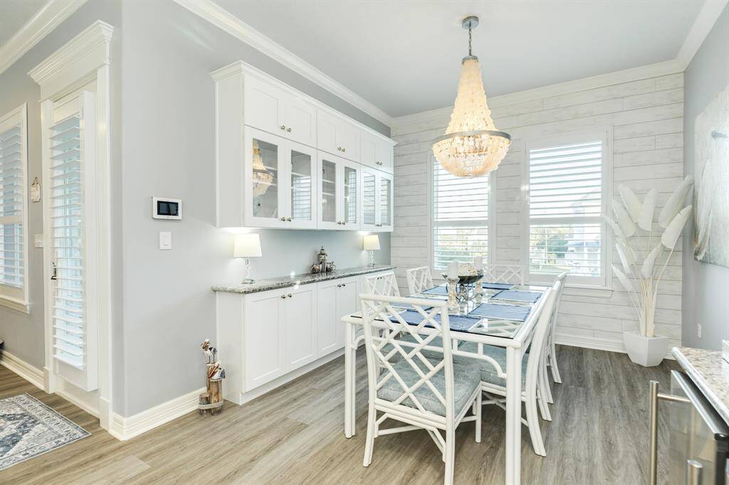 Lovely dining area with convenient upper & lower storage cabinets.