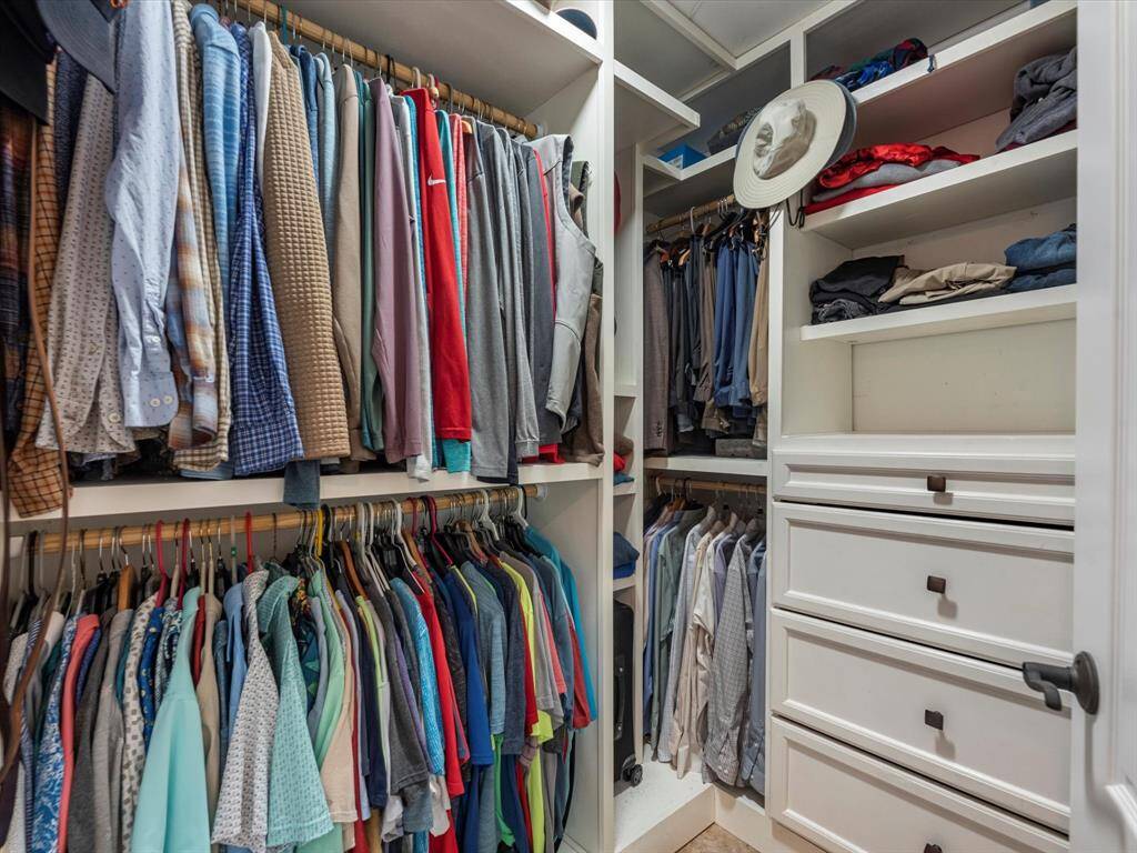 Walk-in His and Hers Closets with custom built-ins (Main Primary)