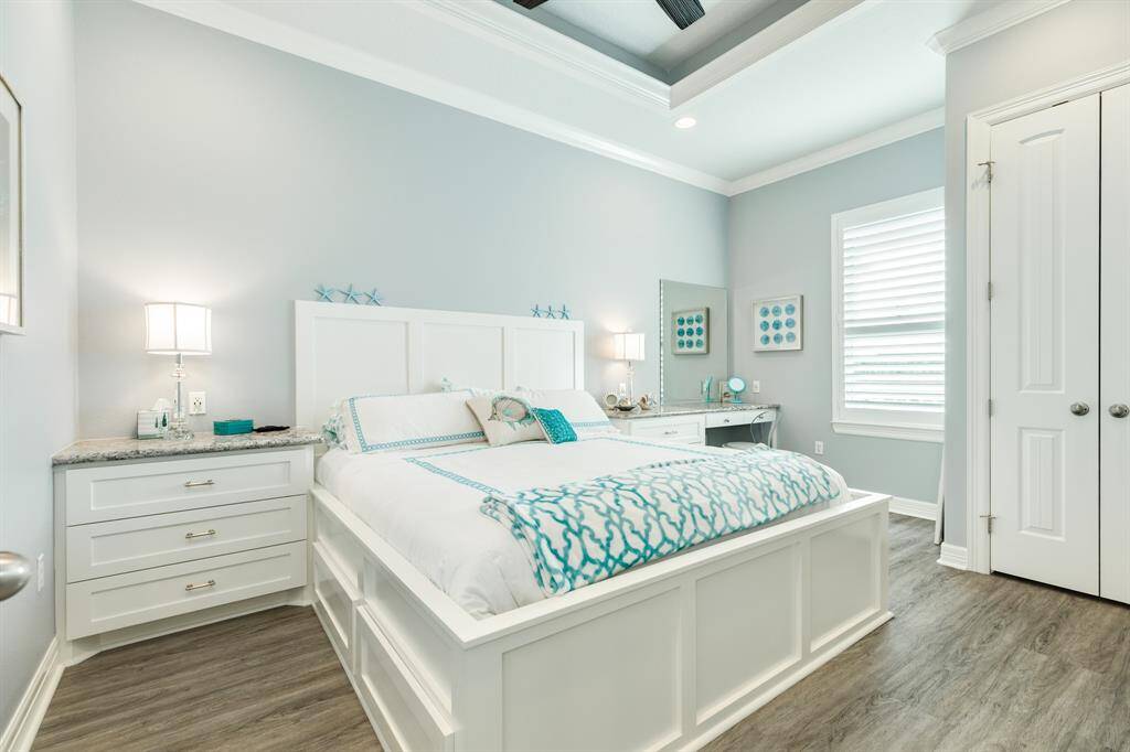 2nd bedroom. Nicely finished out with built ins, coffered ceiling accents and crown molding.