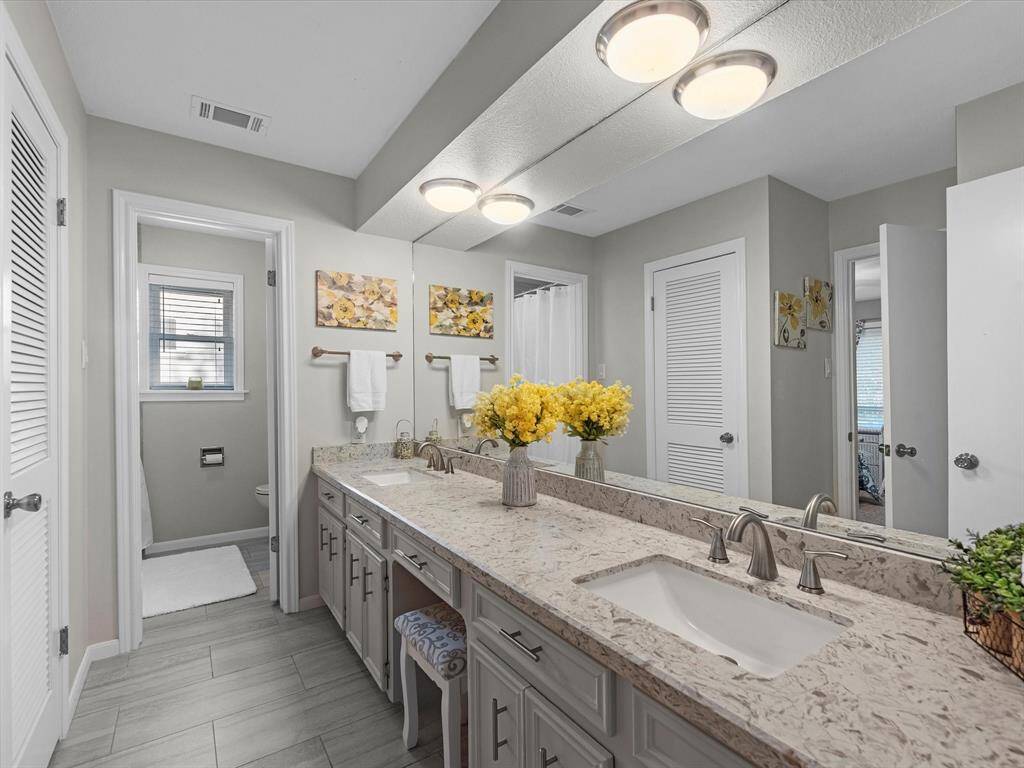 Full secondary bath with tub/shower combo and extra large vanity/dressing area