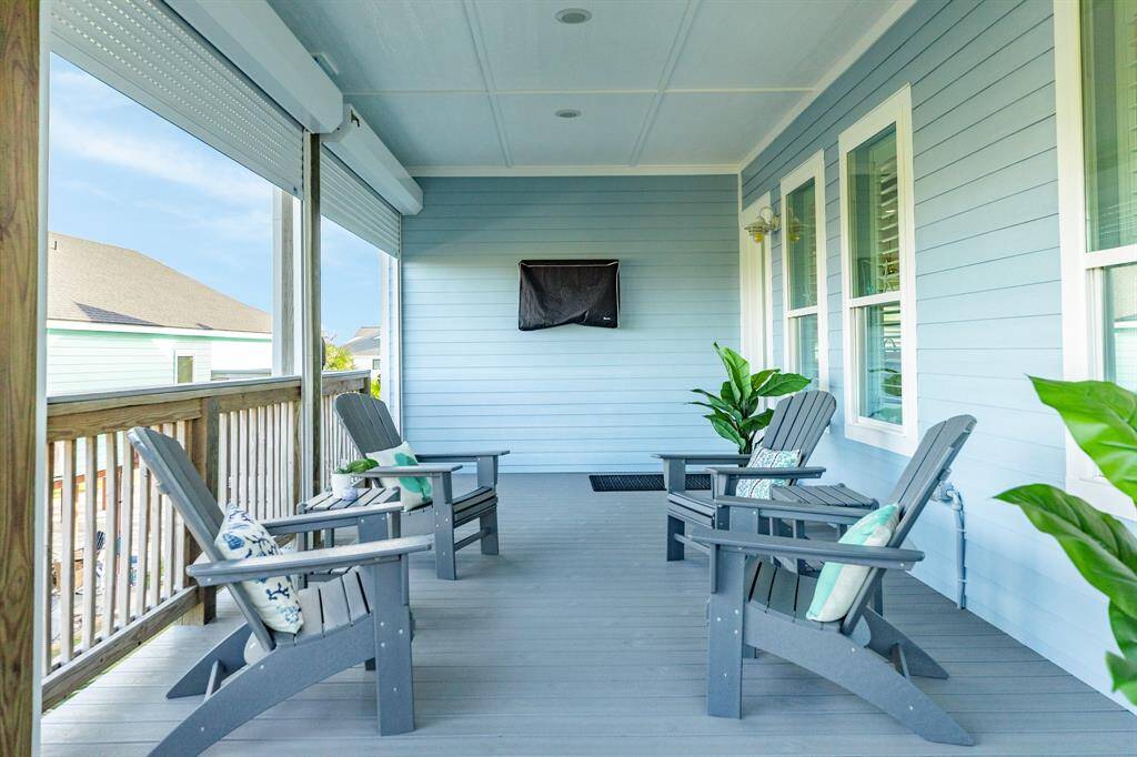 The main deck area, all done with composite decking, includes rolling storm shutters that allow you to control the sun, breezes and inclement weather for year-round enjoyment.