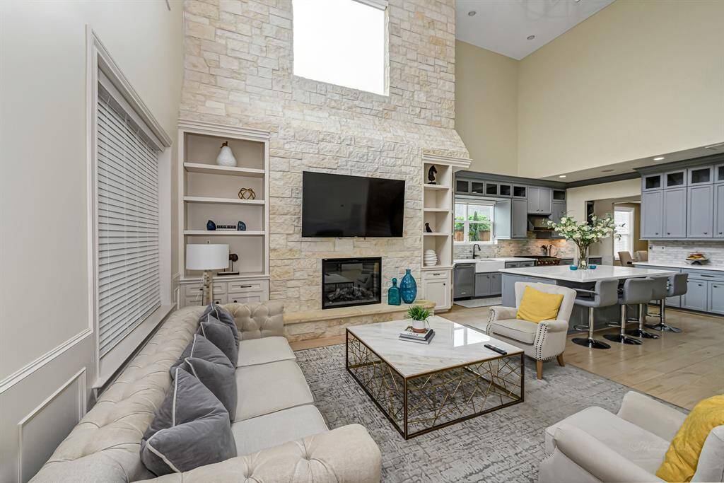 The living area in this luxury home is a stunning combination of warmth, texture, and open design