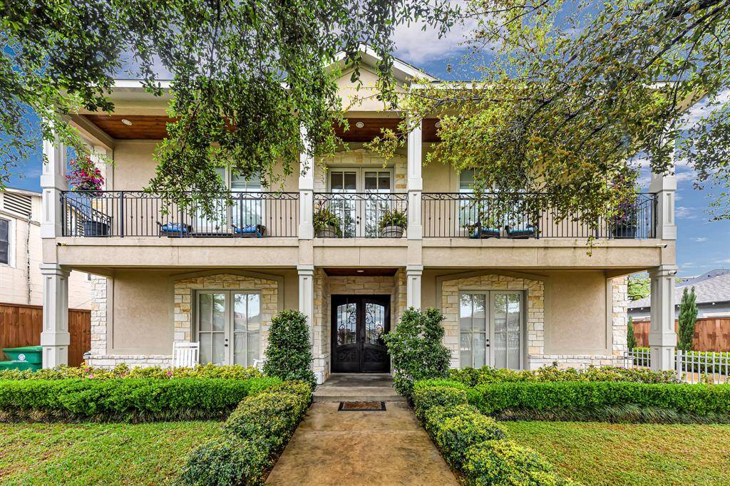 The architectural design of this home using stucco and stone creates a blend of classical and contemporary elements