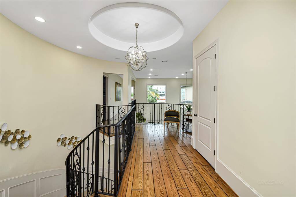 Upstairs hallway which leads to the guest suite and backyard balcony