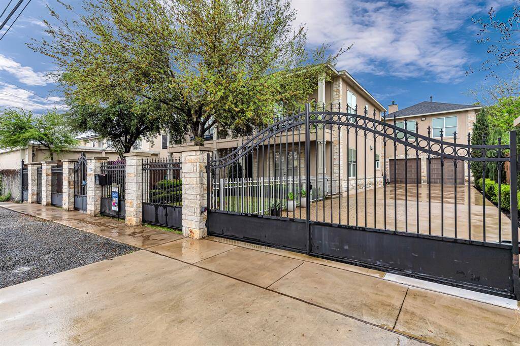 Automatic wrought iron gate adds a touch of elegance as well as additional safety