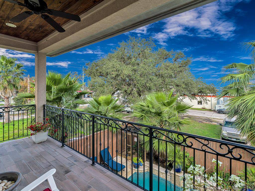 The balcony at the rear of the home offers a serene retreat with open views, making it an ideal spot to unwind and enjoy the fresh air.