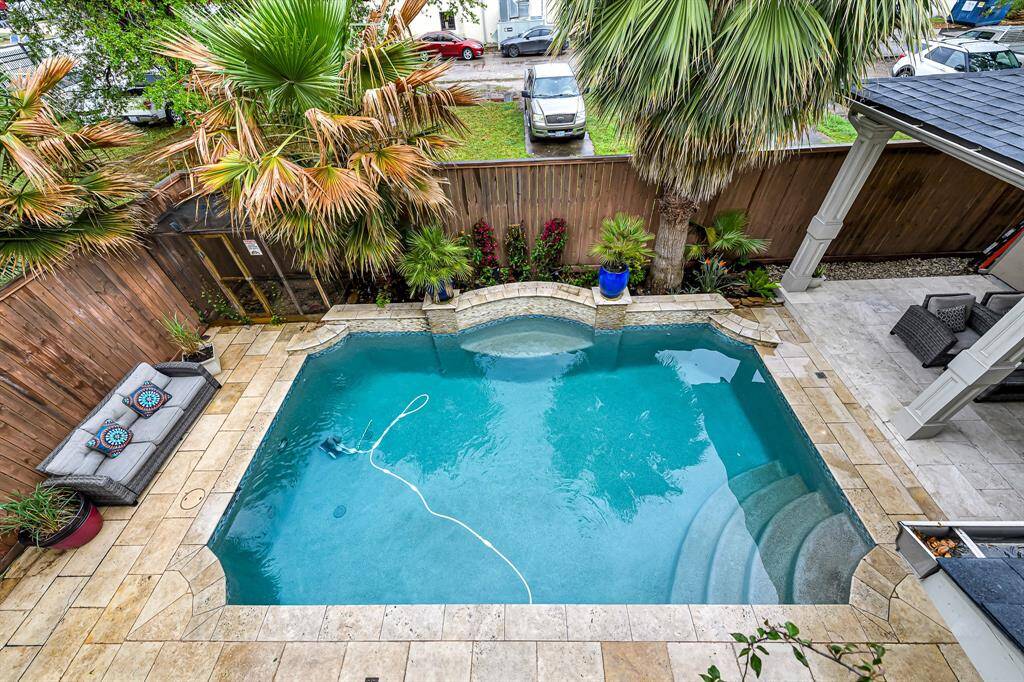 This personal outdoor oasis takes luxury to the next level, offering not only a serene, tropical retreat but also a fully-equipped outdoor kitchen and dining area—perfect for both relaxation and entertaining