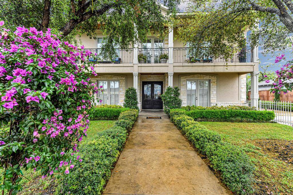 As you pass through the gate, you’re welcomed into a beautifully manicured front yard