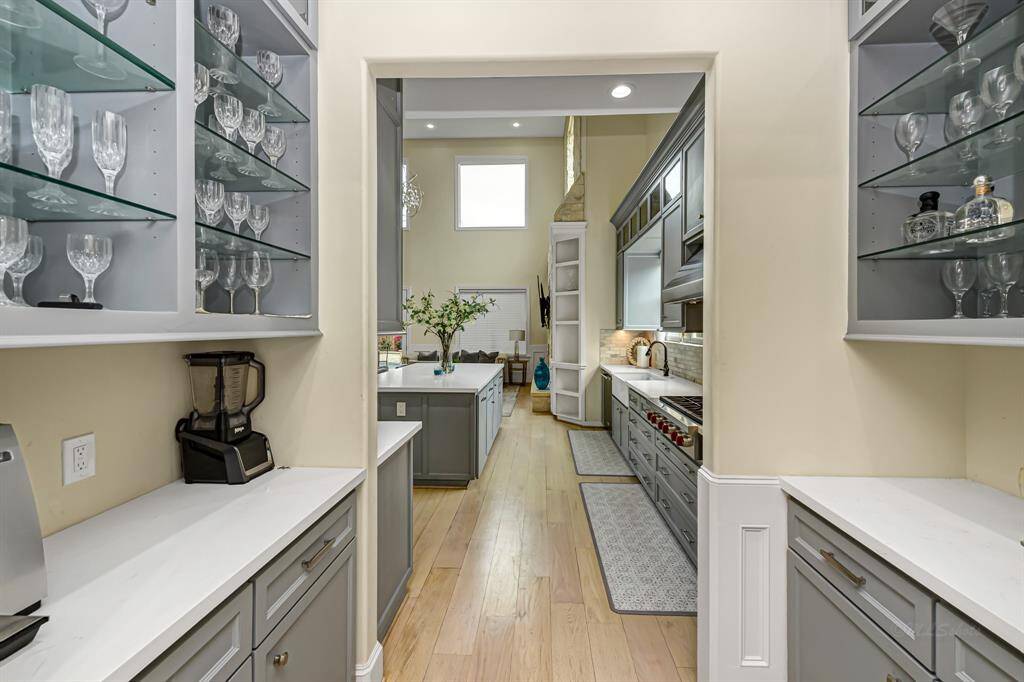 The butler's pantry serves as a bridge between the kitchen and dining room. This area offers plenty of storage and open shelving to display your decorative items or fine china