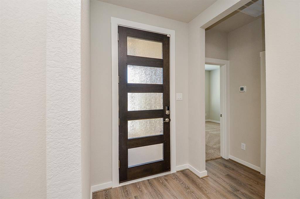 To the left of Entryway 2 secondary bedrooms and a full bathroom
