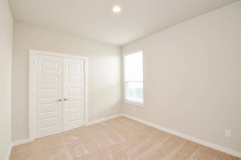 To the left of the Entry way you will find the Secondary Bedroom