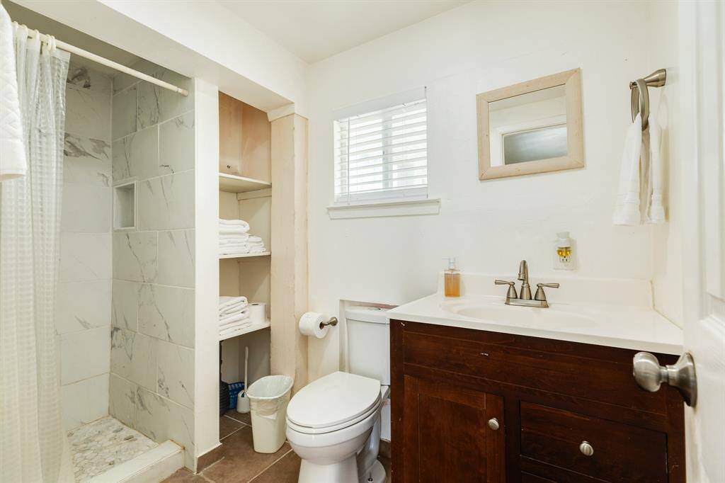 Ground level bath with stand up shower