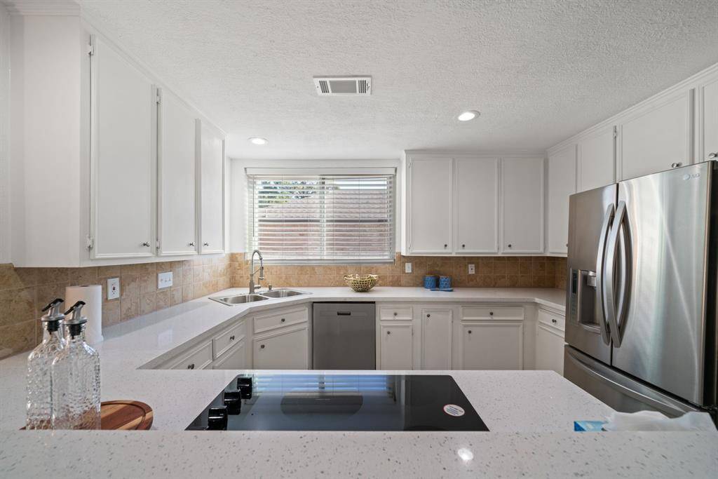 Kitchen Features Smooth Electric Cooktop, Dishwasher, Double Ovens & Stainless Refrigerator