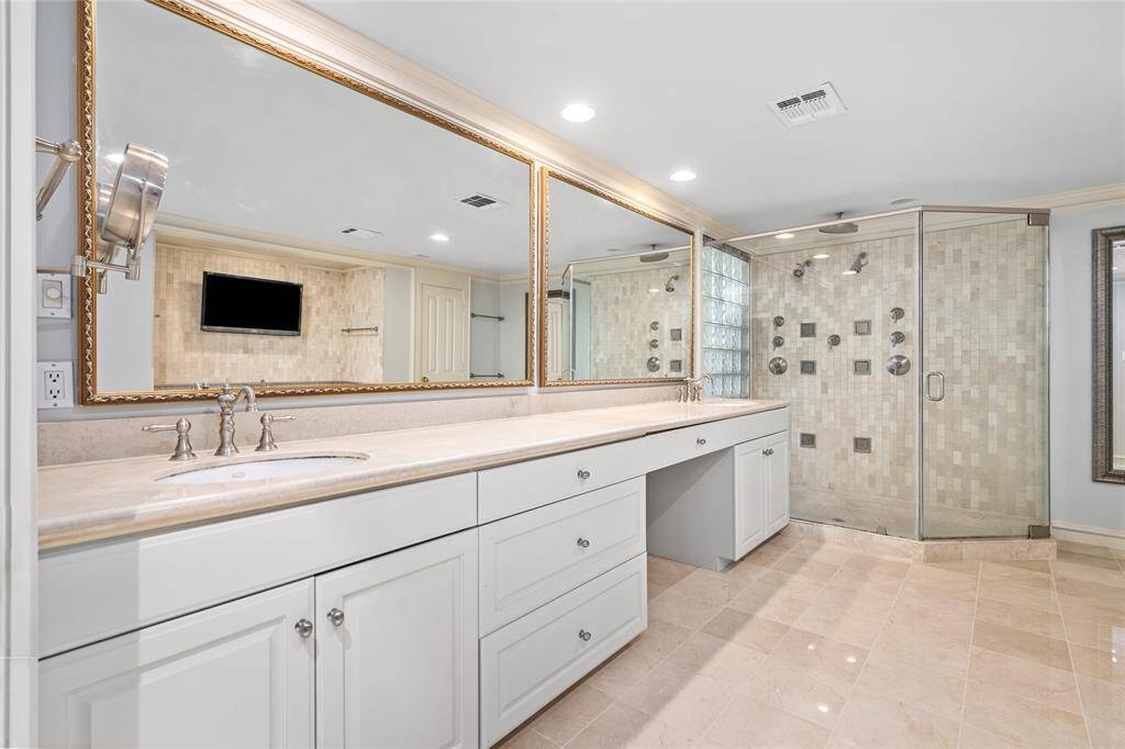 Another view of the floor grand primary bath. Free standing soaking tub and water closet door on the right.