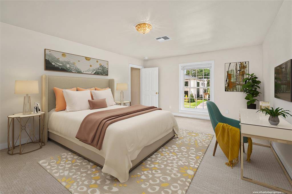Second floor primary bathroom with marble counter tops, vanities with 2 sinks, walk-in closet, door to private water closet and shower. Sconces and close to ceiling lights add modern touches to the setting.