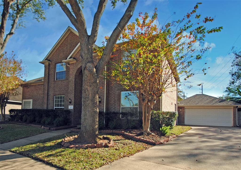 Full brick on three sides with long and wide driveway