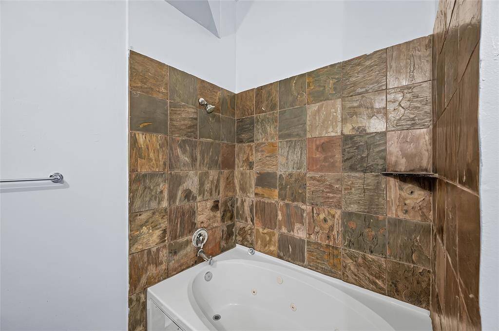 Large jetted soaking tub with shower combo is perfect place to relax and unwind!