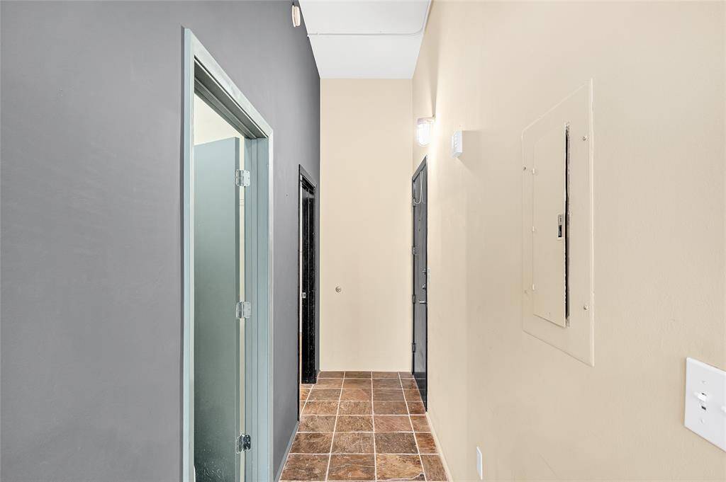 Standing in LR/DR/Bedroom/Kitchen looking down hallway.  Far door on right is entrance to unit. Near left door is approx. 6'x6' Walk-In Closet and far left door is Full Bathroom.