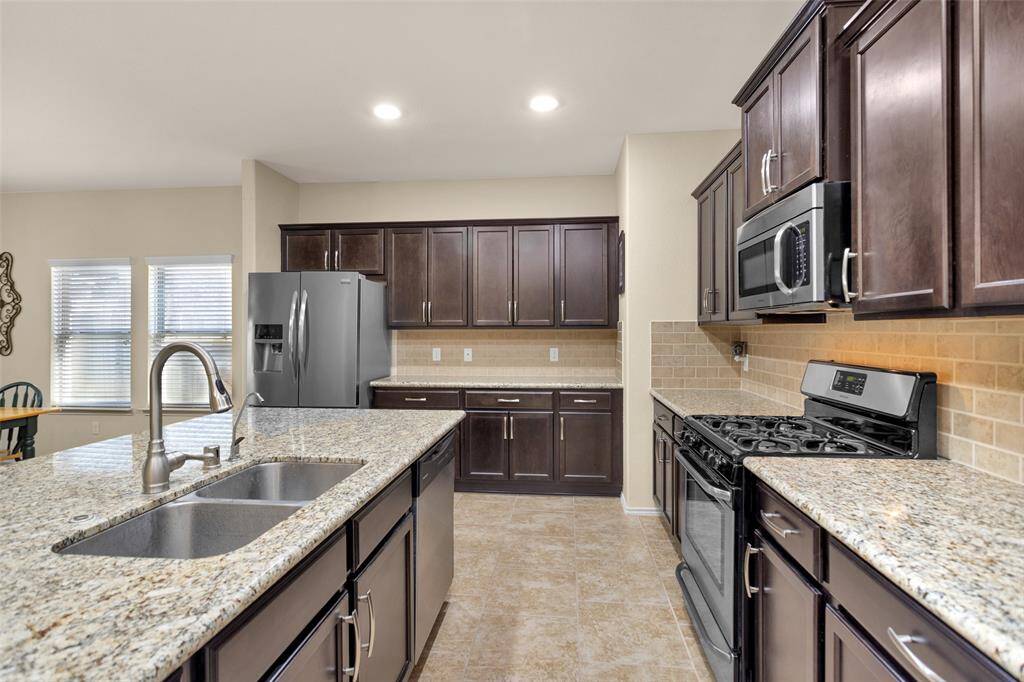 Granite counter and stainless steel appliances.