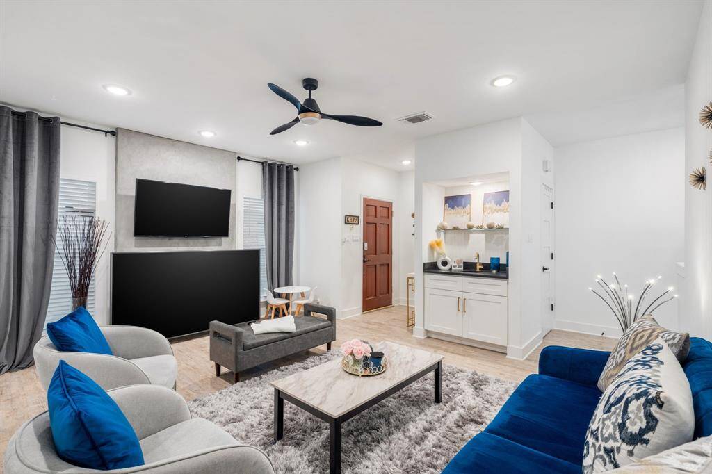 (Please note: Fireplace located behind the second TV)