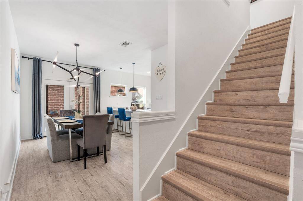 Under the stairs is a good sized full washer & dryer! Upstairs leads to two large bedrooms w/en-suite bathrooms.