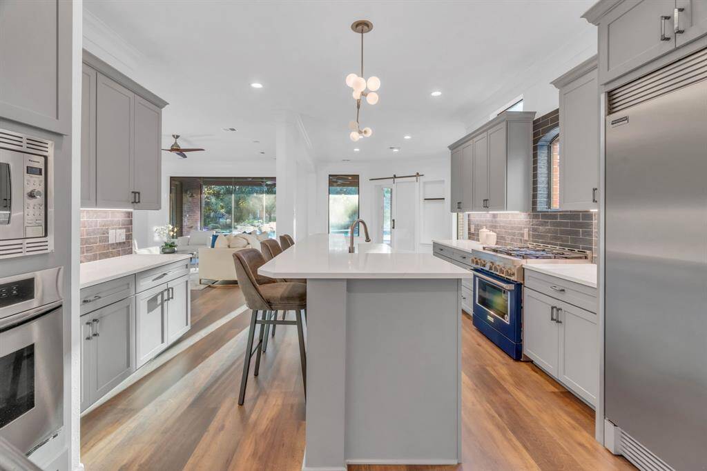 The updated LVT flooring flows seamlessly throughout the first floor, adding a touch of modern elegance while offering durability and style in every room.