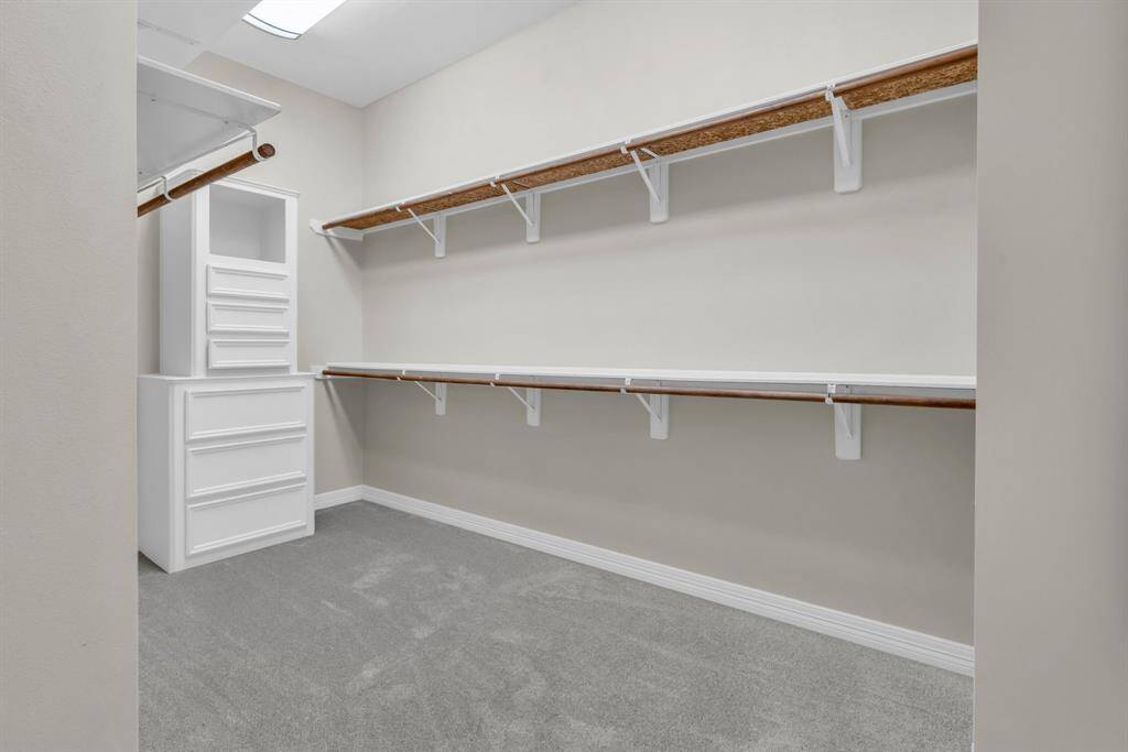 The first of two HUGE walk in closets. Both closets have built in and new carpet!