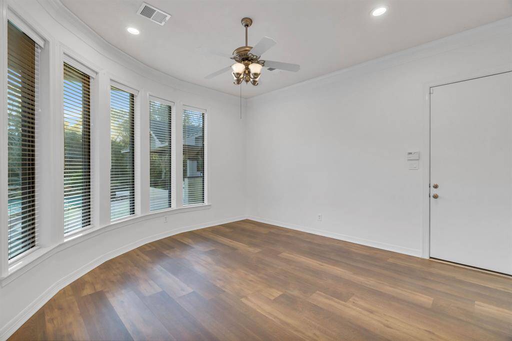 The large flex space off of the breakfast nook/living room area. The door leads to the second two car garage so this room could be a massive MUD room, sun room, game room or a guest suite.