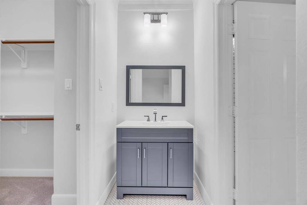 Modern sink, mirror and light fixtures.
