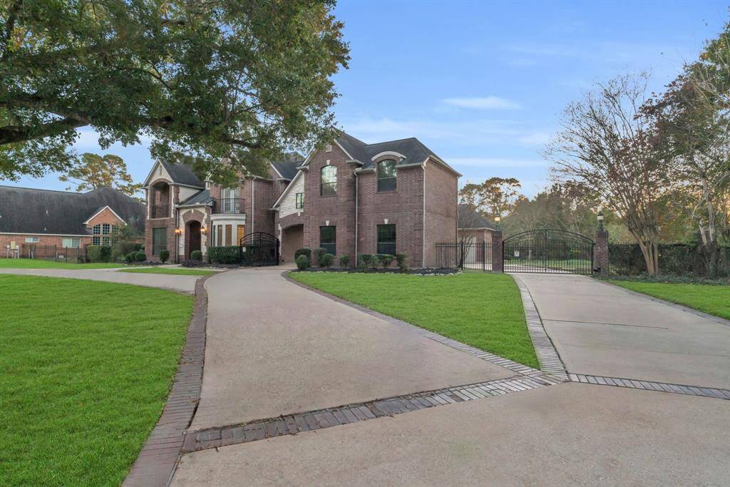The extended circular driveway provides ample space for multiple vehicles, making it ideal for hosting gatherings and ensuring your guests feel welcomed from the moment they arrive.