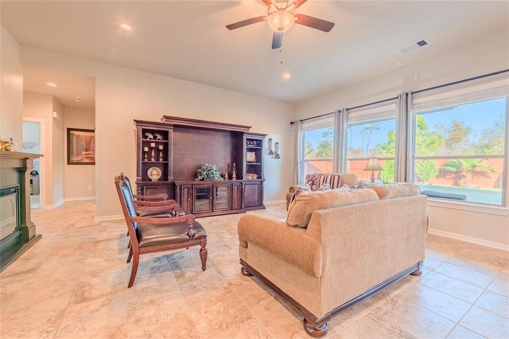 The open floor plan seamlessly connects the living area to the kitchen, offering plenty of natural light and space for gatherings.