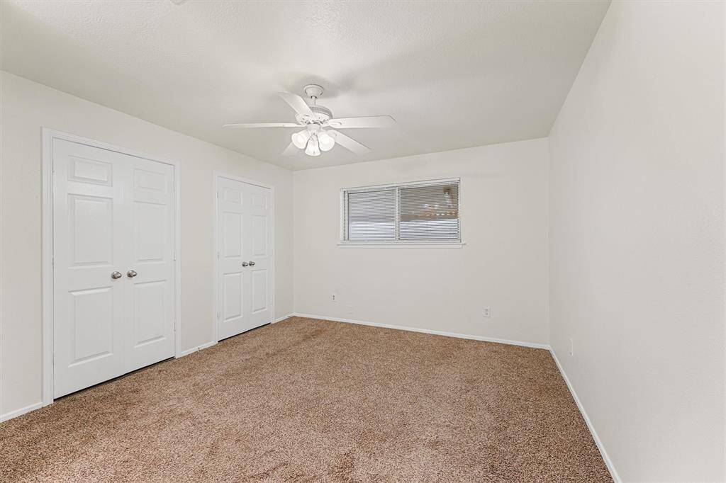 Primary Bedroom with two closets, offering ample storage space.