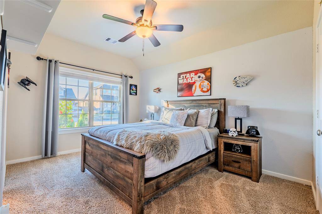 This bedroom is a second primary that comes with its own bathroom.