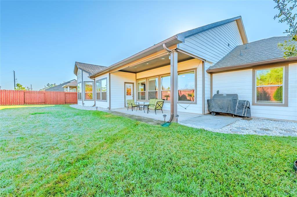 The expansive backyard offers ample space for outdoor activities perfect for enjoying sunny afternoons.