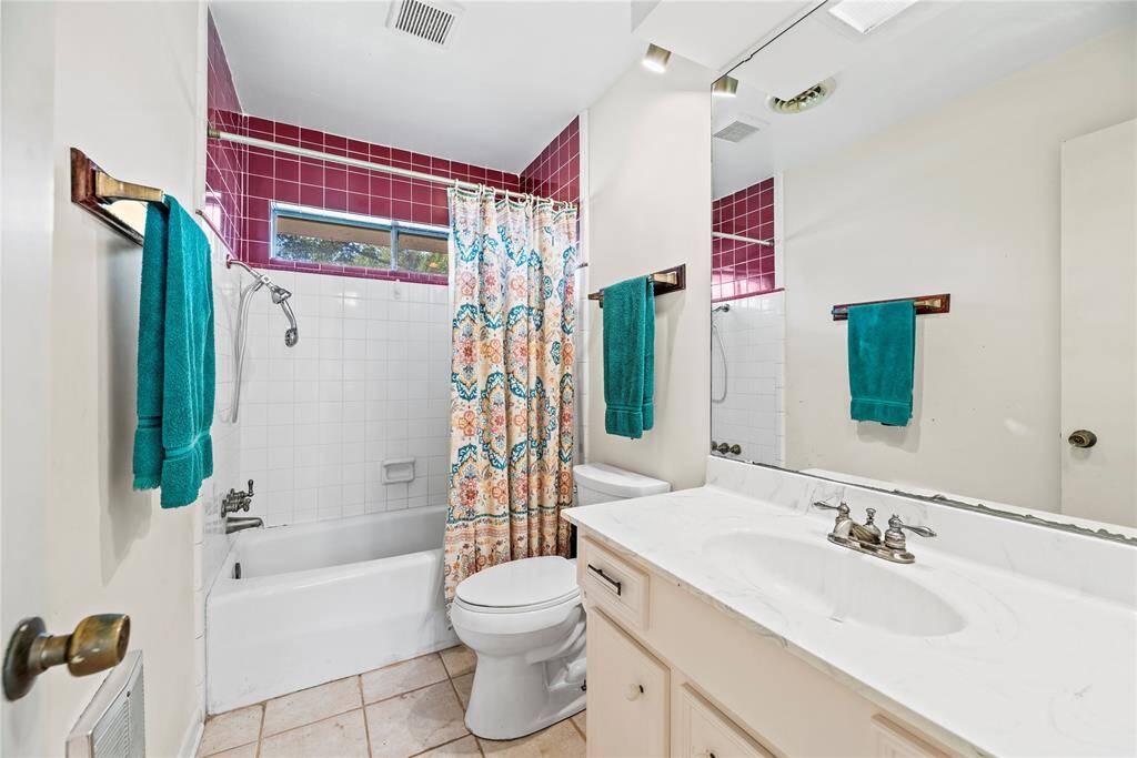 Secondary bathroom shared between two secondary bedrooms. Imagine the possibilities in this home!