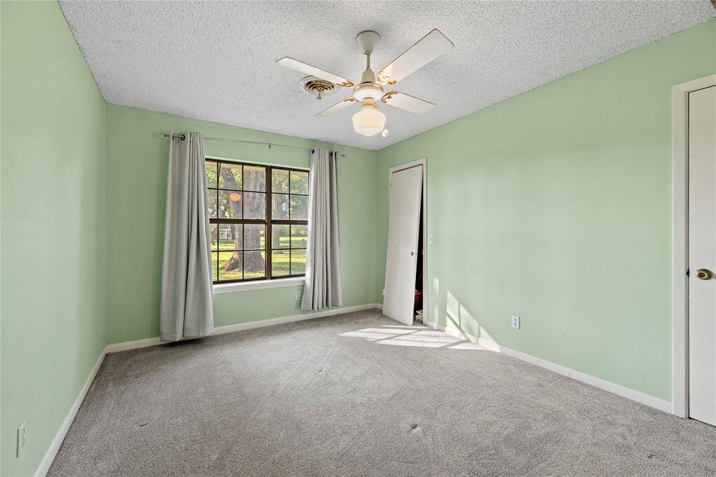 Secondary bedroom with fantastic views of the mature trees and peaceful surroundings.